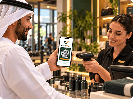 Customer showing a ThereYouGo QR code to a shop assistant at the till